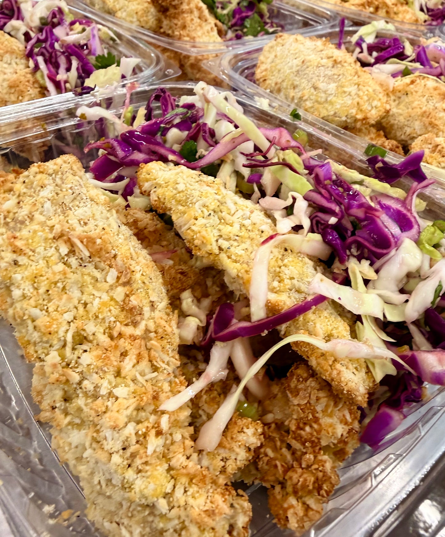 coconut chicken tenders with kale jicama slaw + chili mango dip