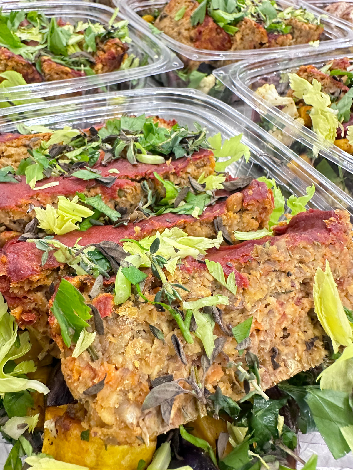 herby lentil loaf with roasted rainbow vegetables