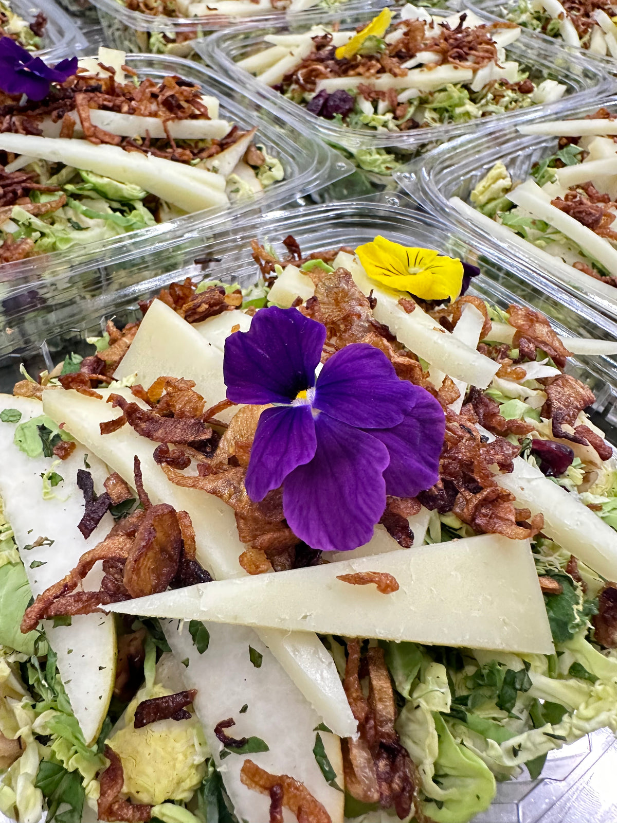 shaved brussels salad with provolone and maple mustard vinaigrette